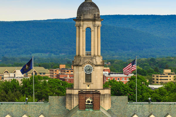 Image of Old Main tower with mountains in background